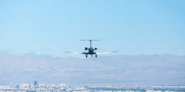 Private jet landing, approaching runway. Luxury travel. - Supply Chain News
