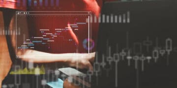Person working on laptop, Gantt chart displayed. EU trade with Ukraine. - Supply Chain News
