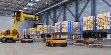 GXO Logistics operates an Automated Logistics Center where robots efficiently navigate the warehouse floor filled with boxes.