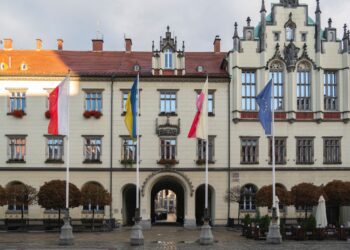 A large building with a clock tower, located in the EU.