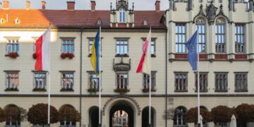 A large building with a clock tower, located in the EU.