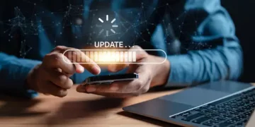 Person using smartphone, progress bar shows "UPDATE..." Digital energy supply chain integration. - Supply Chain News