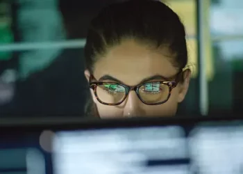 Focused woman working on computer, researching Fairtrade. - Supply Chain News