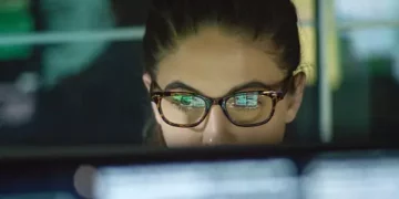 Focused woman working on computer, researching Fairtrade. - Supply Chain News
