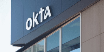 The Okta logo is prominently displayed on the side of a building, highlighting its strong brand presence.