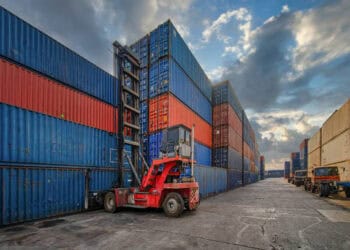 Cargo containers at a US port, illustrating import/export trends. - Supply Chain News