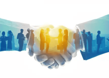 Handshake symbolizing collaboration between businesses, reflecting CEO compensation and corporate social responsibility. - Supply Chain News
