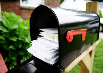 Full mailbox overflowing with mail. USPS holiday surcharges waived. - Supply Chain News