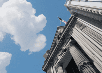 First American Title Insurance settles $1M data breach in New York building with columns and a flag on top.