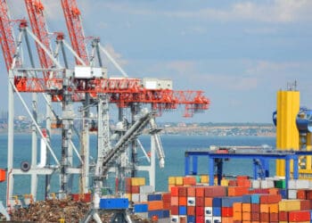 Busy Savannah port with cargo containers and cranes; recent cargo volume drop. - Supply Chain News