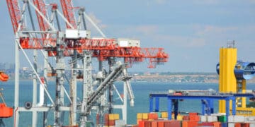 Busy Savannah port with cargo containers and cranes; recent cargo volume drop. - Supply Chain News