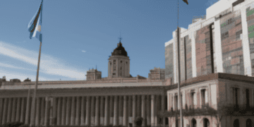 A 3D model of a BRICS building with flags of Argentina in front of it.