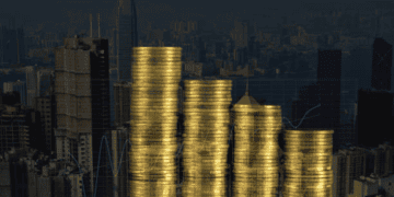 Gold coin stacks decreasing, city skyline background. Ethical gold sourcing. - Supply Chain News