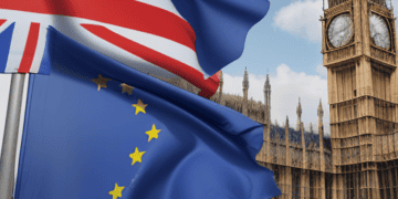 UK and EU flags fly before the Houses of Parliament, symbolizing the post-Brexit trade deal. - Supply Chain News