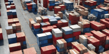 An evolving warehouse full of shipping containers, transforming the supply chain.