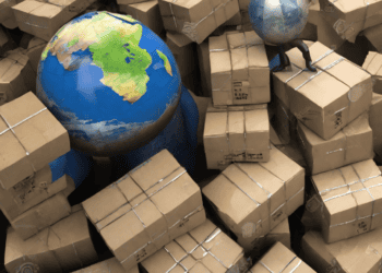A man standing in a pile of boxes, symbolizing trade relations, with a globe in the middle.