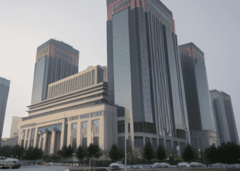 3D rendering of a large building in a city amidst the Evergrande Group's debt crisis.