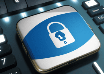 A blue button with a padlock on it on a keyboard, symbolizing the challenges and progress in Brazil's Personal Data Protection efforts.