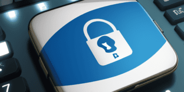 A blue button with a padlock on it on a keyboard, symbolizing the challenges and progress in Brazil's Personal Data Protection efforts.