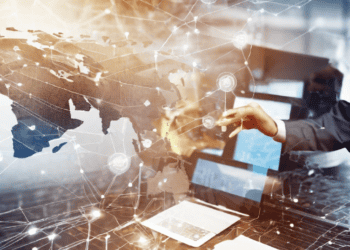 Hands interacting with a digital world map, illustrating global supply chain connectivity and emerging technologies. - Supply Chain News