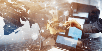 Hands interacting with a digital world map, illustrating global supply chain connectivity and emerging technologies. - Supply Chain News