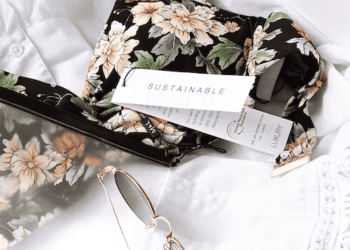 Floral swimsuit with "Sustainable" and "Luxury" tags. Sustainability in luxury fashion. - Supply Chain News