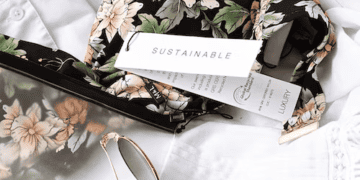 Floral swimsuit with "Sustainable" and "Luxury" tags. Sustainability in luxury fashion. - Supply Chain News