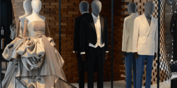 Luxury menswear and womenswear displayed on mannequins in a high-end retail space. Brands leasing significant space. - Supply Chain News