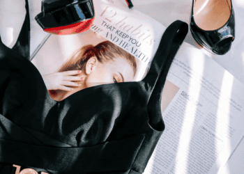 Black heels, luxury dress, and magazine featuring 12 habits for health and well-being. - Supply Chain News