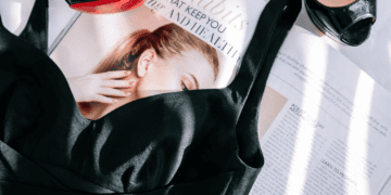 Black heels, luxury dress, and magazine featuring 12 habits for health and well-being. - Supply Chain News