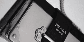 Prada Milano handbag with silver hardware, showcased on a luxury resale platform. - Supply Chain News