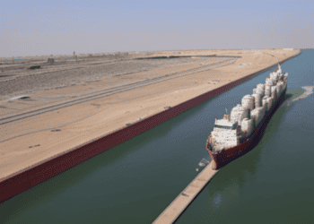 A large ship resumes normal operations after a tanker collision in the Suez Canal.