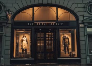 Burberry store front at night. "Burberry" signage is visible. - Supply Chain News