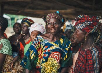 Group of African women in colorful head wraps and clothing. - Supply Chain News