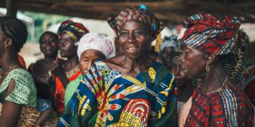 Group of African women in colorful head wraps and clothing. - Supply Chain News