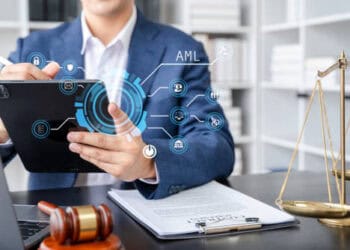 A man in a suit is using a tablet while holding a judge's hand, as part of a resident's sentence in Fort Collins.