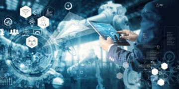 Person using tablet to monitor industrial AI systems, illustrating international AI regulations. - Supply Chain News