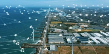 Aerial view of a coastal industrial park using wind turbines and blockchain technology for enhanced supply chain management. - Supply Chain News