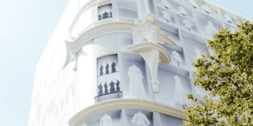 Dior flagship store exterior, showcasing elegant white dresses. LVMH luxury brand. - Supply Chain News