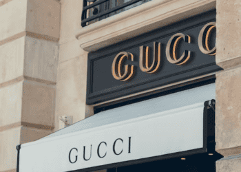 Gucci store front with awning displaying the brand name. Secondhand luxury goods and trademark law. - Supply Chain News