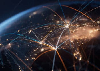 A close up image of a globe with intricate lines representing global trade and market connections.