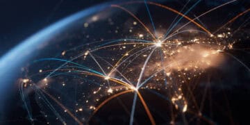 A close up image of a globe with intricate lines representing global trade and market connections.