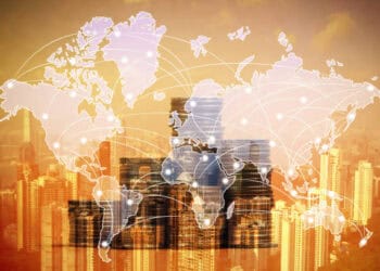 A map of the world with a city in the background.