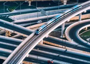An aerial view of a train traveling on a highway in Kazakhstan.
