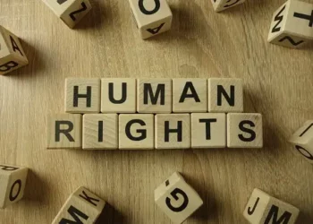 The word human rights spelled out on wooden blocks amid Sudan's RSF senior commanders and US sanctions.