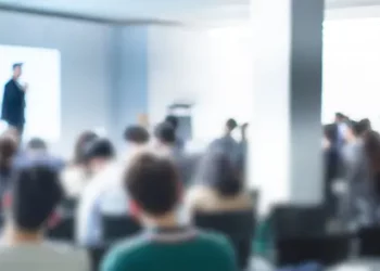 Blurred image of a business presentation with audience. Enterprise risk management concept. - Supply Chain News