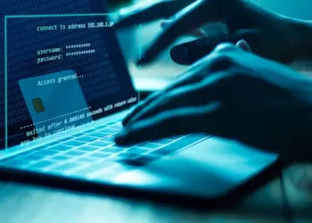 Hacker accessing financial data on laptop, showing "Access Granted" message and credit card details. Cybersecurity threat. - Supply Chain News