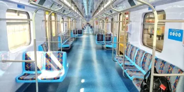 The impact of a transport strike is minimal inside a subway train with blue seats.