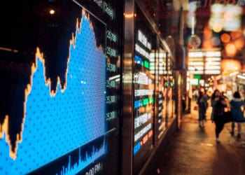 Stock market data displayed on a screen showing a sharp decline, reflecting potential impacts of China tariffs on importers and consumers. - Supply Chain News