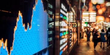 Stock market data displayed on a screen showing a sharp decline, reflecting potential impacts of China tariffs on importers and consumers. - Supply Chain News